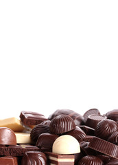 Many different chocolate candy isolated on white
