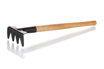 Garden rake isolated on white