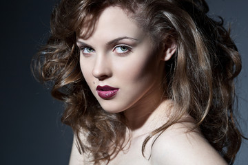 Fototapeta premium Closeup portrait of a sexy young caucasian woman with red lips