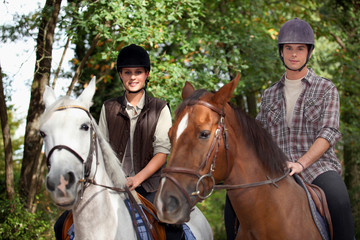 Young people horseriding