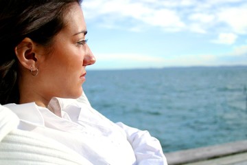 Woman walking along the waterfront