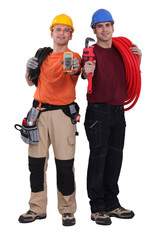 Electrician and plumber displaying equipment
