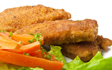 chicken fried in breadcrumbs with vegetables