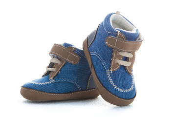 Blue baby shoes isolated on white background