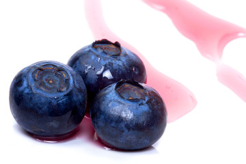 Close up of blueberries with sauce on the plate