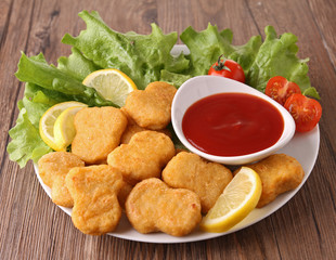 plate of nuggets and salad