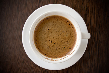 white cup with black coffee