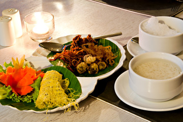 Khao Chae, an ancient Thai food, rice in cold water with ice ser