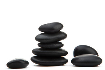 zen stones. Black massage stones stacked, isolated.