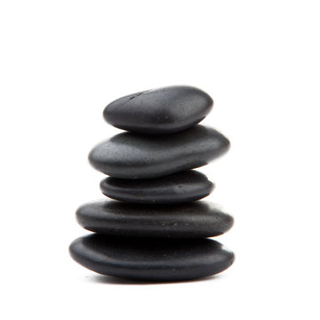 zen stones. Black massage stones stacked, isolated.