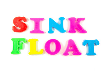 sink and float written in fridge magnets