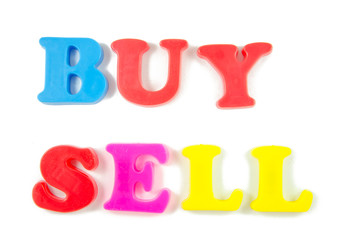 buy and sell written in fridge magnets