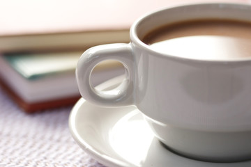 A cup of coffee and book s