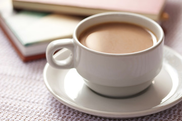 A cup of coffee and book