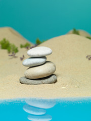 Fototapeta na wymiar kamienna wieża w tle brzegu morza miniaturowego