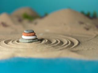 zen rocks tower in miniature landscape