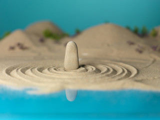 Fototapeta na wymiar zen rock sand circles miniature landscape
