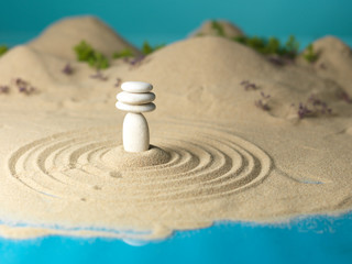 zen rocks tower in miniature landscape