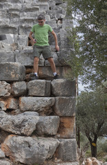 Mature Man moving down in ancient Amphitheater