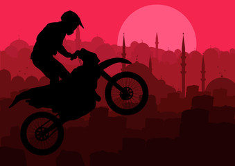 Motorbike rider in Arabic city landscape background