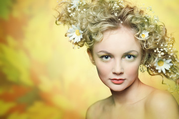 portrait of beautiful girl with flowers in their hair