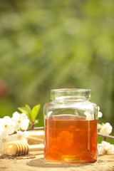 Flowery honey in glass jar