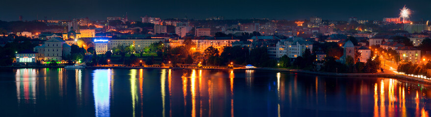 Ternopil city night skyline panorama over lake with colorful ref