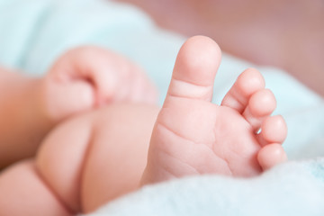 baby's foot on blanket