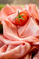Mortadella slices with red pepper