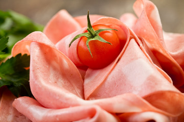 Mortadella slices with red pepper