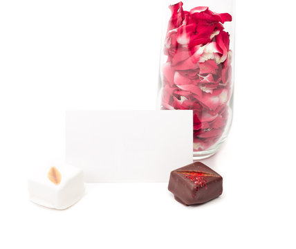 Rose petals in champagne flute with chocolates