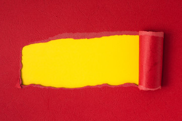 Red torn paper with yellow space for text