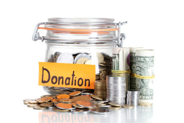 Clear glass jar for tips with money isolated on white. Ukrainian