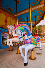 Colorful horses in the carousel