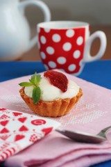 Strawberry tart with cream and coffee