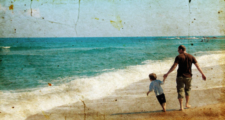 father and son playing together on the beach. Photo in old image - 38337267