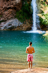 man and a beautiful waterfall © Mauro Rodrigues
