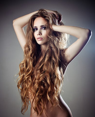 Beautiful sexy woman with long curly hair