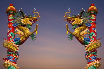 Fototapeta premium Climb dragons statue two towers in the sky.