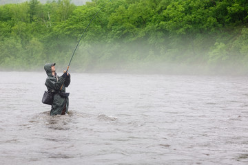 Fisherman caught a salmon river