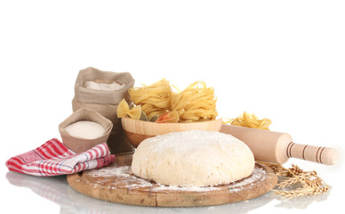 ingredients for homemade pasta on wooden plate isolated on white