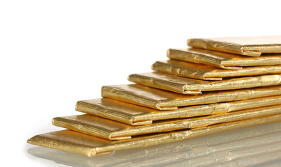 chewing gums wrapped in golden foil, isolated on white