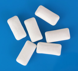 Chewing gums on blue background