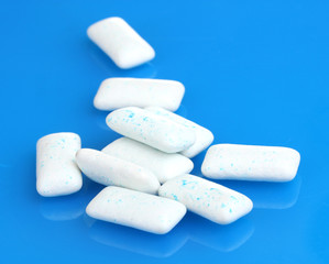 chewing gums on blue background