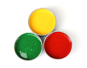 open tin cans with paint and brushes isolated on white