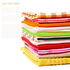 Pile of linen kitchen towels on a white background (sample text)