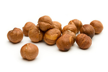 Hazelnuts on the white background