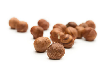 Hazelnuts on the white background