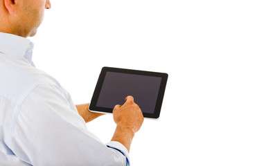Handsome man using a tablet computer against a white background