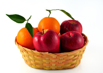 Oranges and apples in a wicker basket